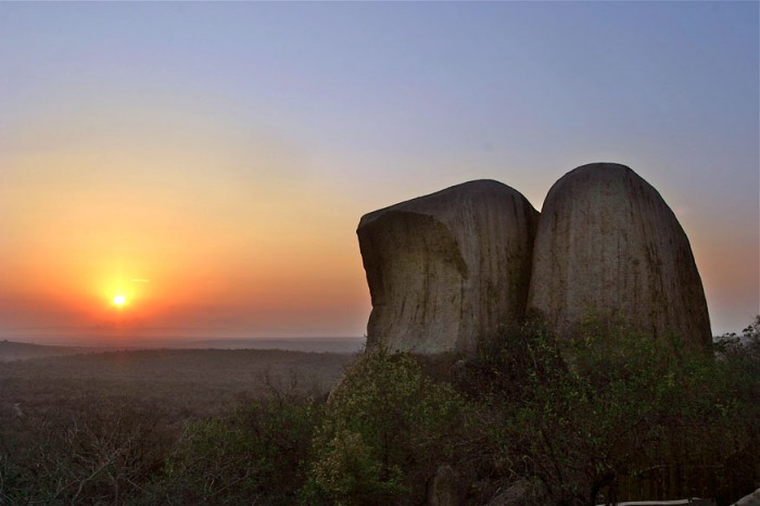 Kwa Madwala sunrise over rocks - photograph by John Hogg
